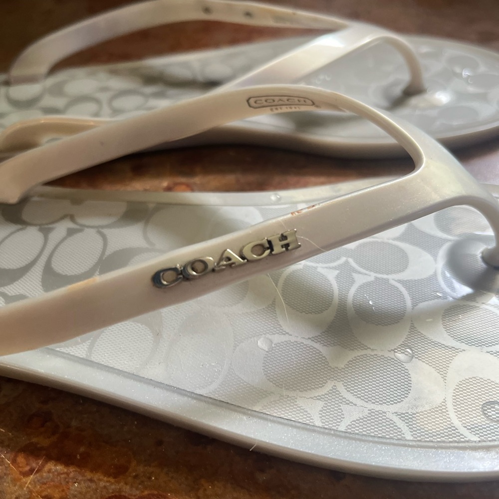 Size 7 (fits more like a 6.5) hard jelly coach sandal. Like new